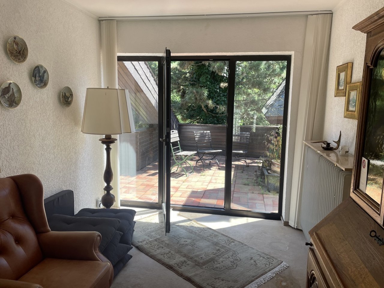 Aufenhaltsbereich im OG mit Zugang zur Terrasse Aufenhaltsbereich im OG mit Zugang zur Terrasse